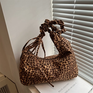 Leopard print canvas tote bag with scrunchie handle and decorative side ribbons