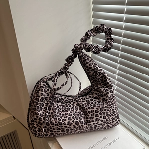 Leopard print crescent hobo bag with ruched handle and side tassel in vintage style