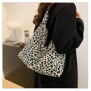 Detailed view of fashionable leopard print shoulder bag with stylish black and white pattern