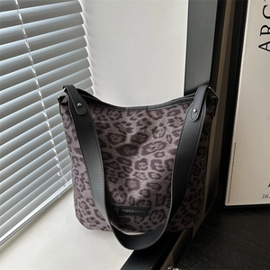 Leopard print tote bag with black leather straps and silver rivets for casual wear