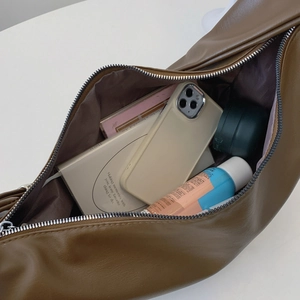 Large dark brown shoulder bag with spacious interior for smartphone and notebook
