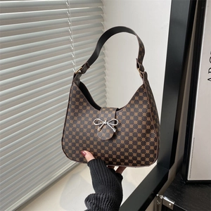 Brown half-moon underarm bag with yellow geometric pattern and silver bow buckle