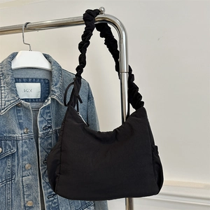 Minimalist black nylon cloud shoulder bag with stylish ruched straps for daily wear
