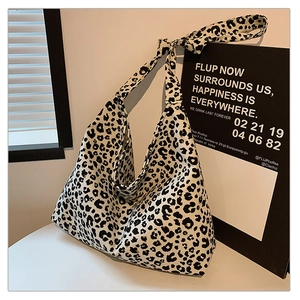 Detail of leopard print canvas tote bag with wide adjustable shoulder strap