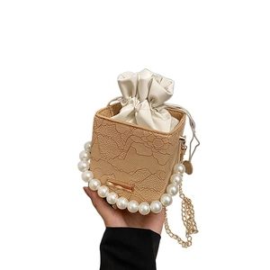 Mini lace crossbody bag with pearl handle and gold chain strap in beige for women