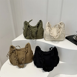 Minimalist nylon cloud bags in four colors with ruffled handles and side pockets