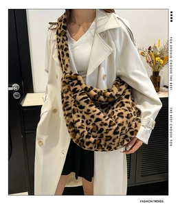 Detailed view of plush leopard print crossbody bag with soft faux fur texture