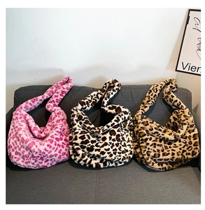 Detailed plush texture of leopard print hobo bags in pink, white, and brown colors