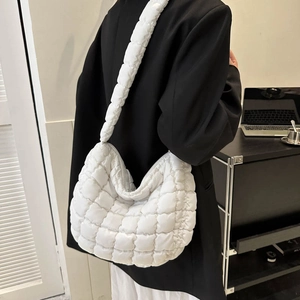 White quilted puffer shoulder bag with crossbody strap for women in minimalist style