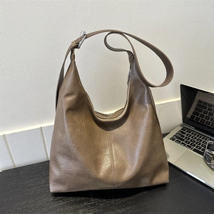 Brown faux leather hobo shoulder bag with adjustable strap and large capacity for commuting