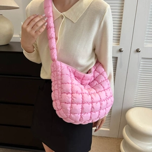 Pink quilted cloud shoulder bag with puffy padding and soft nylon texture for women