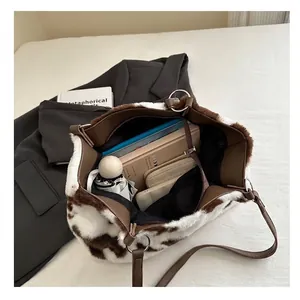 Faux fur cow print tote bag with brown straps and large capacity for daily essentials