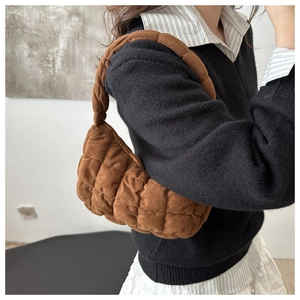 Brown quilted puffer shoulder bag in suede texture with stylish stitched patterns