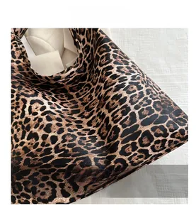 Close-up of the vintage leopard print texture and high-quality fabric on a tote bag