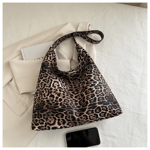Detailed top view of a large leopard print hobo tote bag with textured synthetic leather