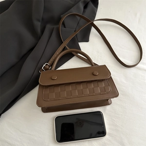 Brown checkered textured crossbody bag with dual decorative round buckles for women