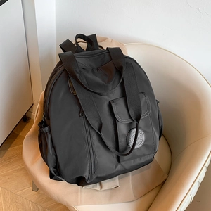 Versatile black waterproof nylon backpack with large capacity for travel or school use