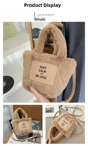 Detail view of khaki faux fur bucket bag with leather patch and long shoulder strap