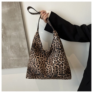 Detailed close-up of a large leopard print tote bag made of soft canvas material
