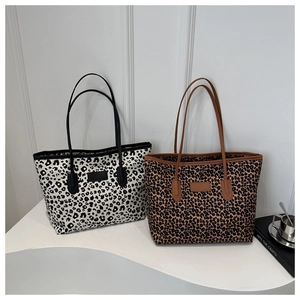 Detailed comparison of chic leopard print tote bags in black-white and brown-black tones