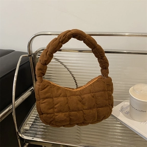 Chic brown quilted hobo bag with a soft puffy texture and sleek zip closure design