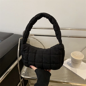 Minimalist black quilted shoulder bag with puffy square pattern for women's daily commute