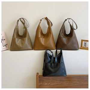 Minimalist soft PU leather bucket bags in four colors with adjustable wide straps