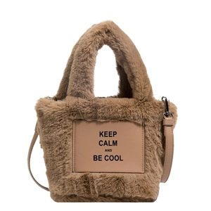 Brown plush bucket handbag with shoulder strap and KEEP CALM leather patch detail