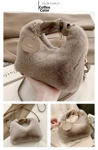 Detail of coffee brown faux fur handbag featuring soft plush texture and golden chain strap