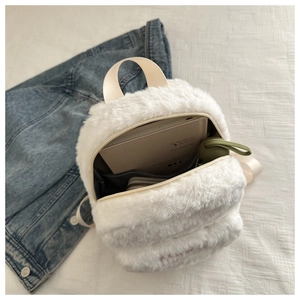 Top view of the white plush mini backpack with a wide opening showing spacious interior storage