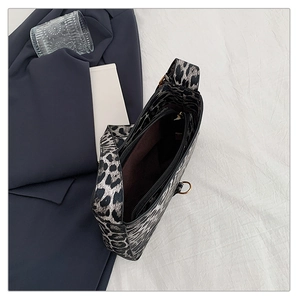 Top view of leopard print shoulder bag with zipper detail and stylish metal hardware