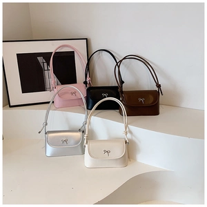 Collection of stylish square crossbody bags with metallic bow detail in five colors