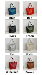 Detail showing eight colors of crocodile embossed tote bags with long shoulder straps