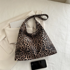 Spacious leopard print canvas tote bag casual shoulder hobo bag for women on beige blazer