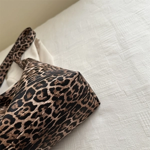 Large leopard print tote bag with textured faux leather finish and durable shoulder straps