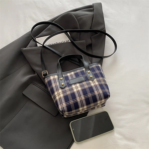 Classic plaid mini tote bag in navy and beige fabric with black leather handles
