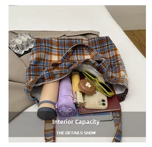 Top view of the plaid tote bag showing its spacious inner compartment and grey lining