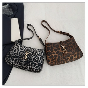 Leopard print baguette shoulder bag with adjustable strap and metal hardware detail