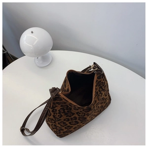 Top view of large leopard print bag showing zipper closure and spacious brown interior