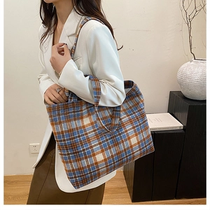 Close-up of tartan wool tote bag with large capacity shown in a lifestyle setting