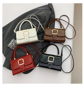 Detail view of retro PU leather crossbody bags in four colors with gold metal buckles