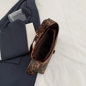 Leopard print underarm shoulder bag with chain strap and spacious interior lining