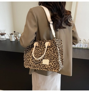 Detail of leopard print canvas tote bag showing high-quality fabric and shoulder strap