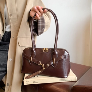 Retro dark brown glossy tote bag with long handles and fashion buckle detail