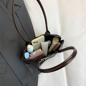 Vintage dark brown glossy tote bag with spacious interior for daily essentials