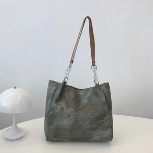Minimalist grey marble texture tote bag with silver chain and brown leather strap
