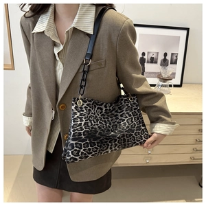 Detail of leopard print tote with mixed leather chain strap and gold hardware