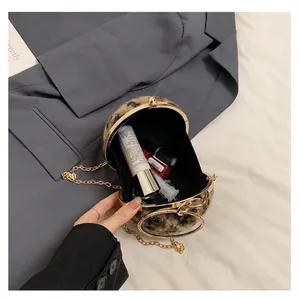 Runde Handtasche mit Leopardenmuster, Goldkette und Kristallring-Handgriff