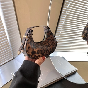 Stylish leopard print crescent underarm bag with gold hardware and top handle for women