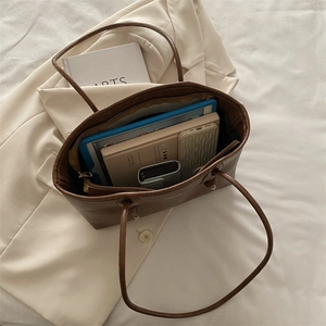 Vintage brown leather tote bag with large capacity for laptop and essentials
